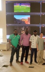 Petflourish team installing monitor wall